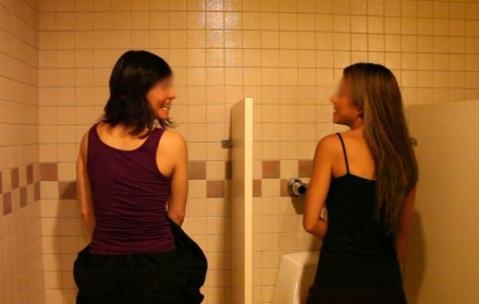 Two-Girls-Using-urinal